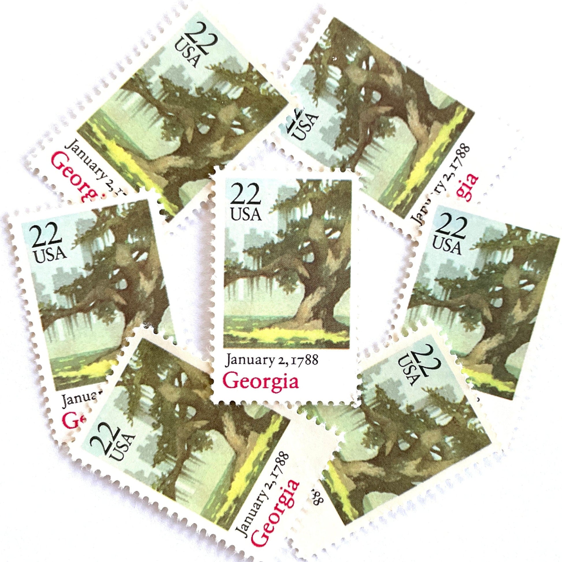 Image of Georgia Statehood postage stamps from the 1988 Bicentenary Statehood series, featuring a green live oak tree with Spanish moss and Atlanta skyline on vintage unused 22-cent USPS postage, Scott 2339.
