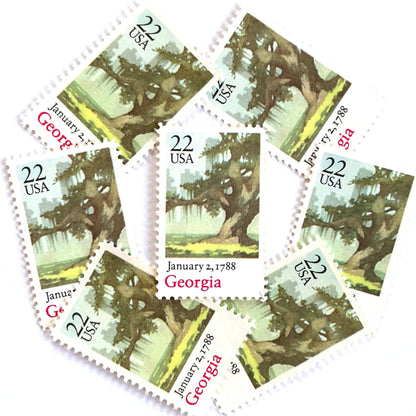 Image of Georgia Statehood postage stamps from the 1988 Bicentenary Statehood series, featuring a green live oak tree with Spanish moss and Atlanta skyline on vintage unused 22-cent USPS postage, Scott 2339.