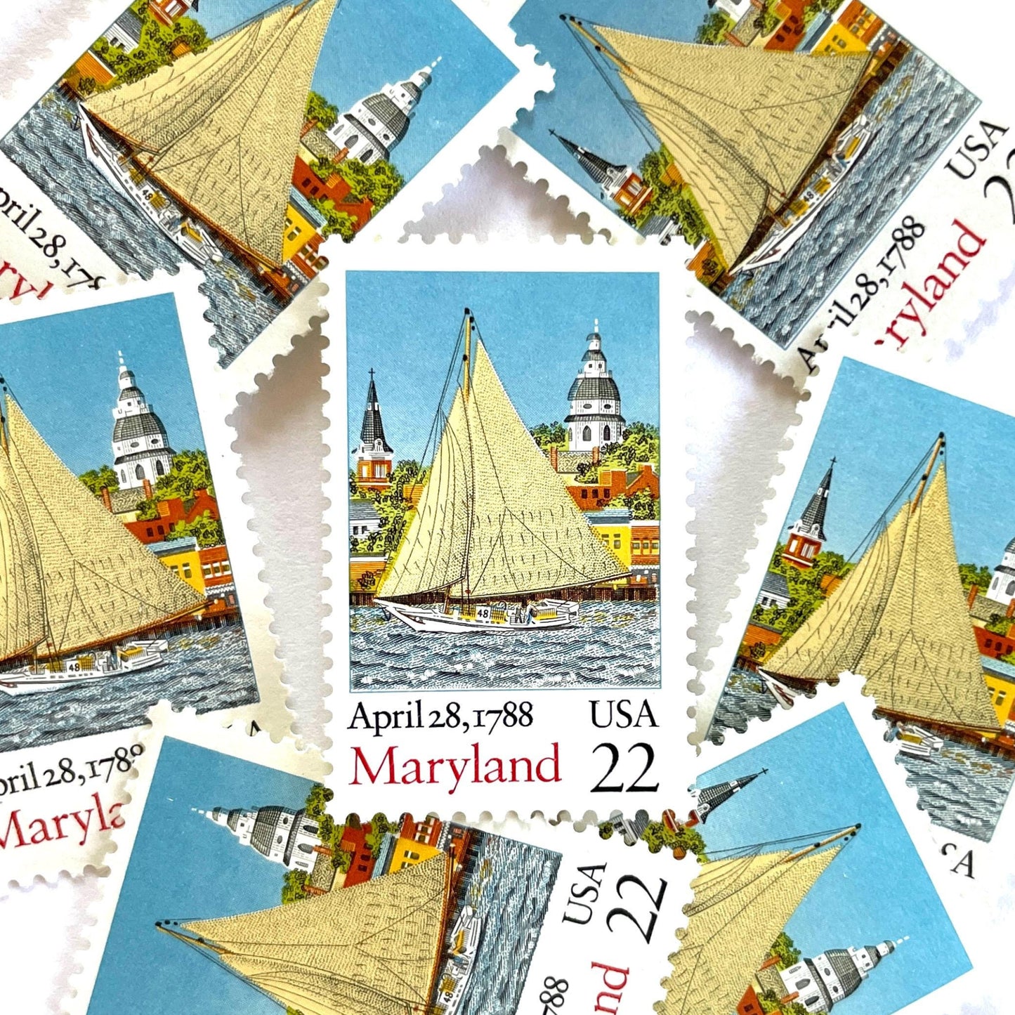 Image of Maryland Statehood postage stamps from the 1988 Bicentenary Statehood series, featuring the State House, a skipjack sailing on Chesapeake Bay in Annapolis and other historic Maryland statehood imagery on vintage unused 22-cent USPS postage, Scott 2342.