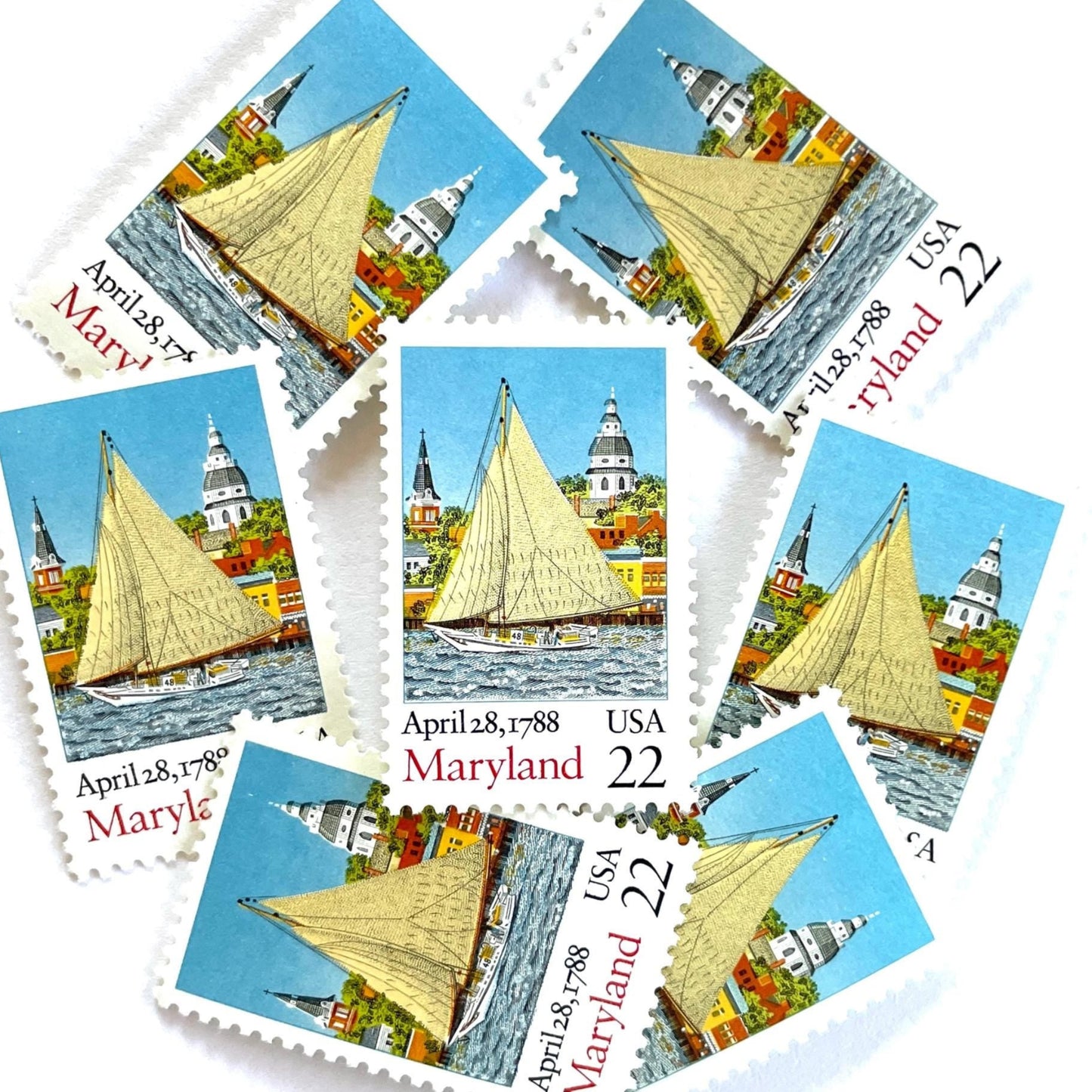 Image of Maryland Statehood postage stamps from the 1988 Bicentenary Statehood series, featuring the State House, a skipjack sailing on Chesapeake Bay in Annapolis and other historic Maryland statehood imagery on vintage unused 22-cent USPS postage, Scott 2342.