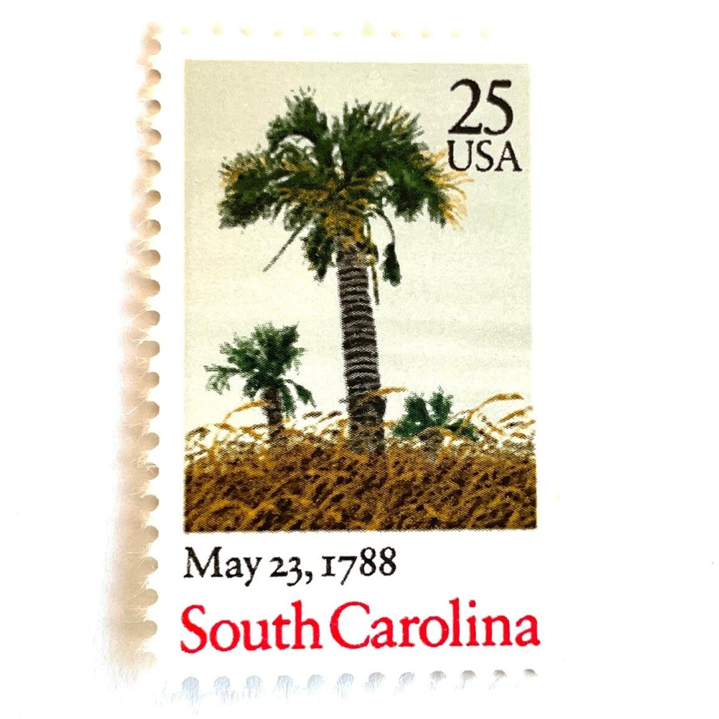 Image of South Carolina Statehood postage stamps from the 1988 Bicentenary Statehood series, featuring green palmetto trees and sea oats on vintage unused 25-cent USPS postage, Scott 2343.