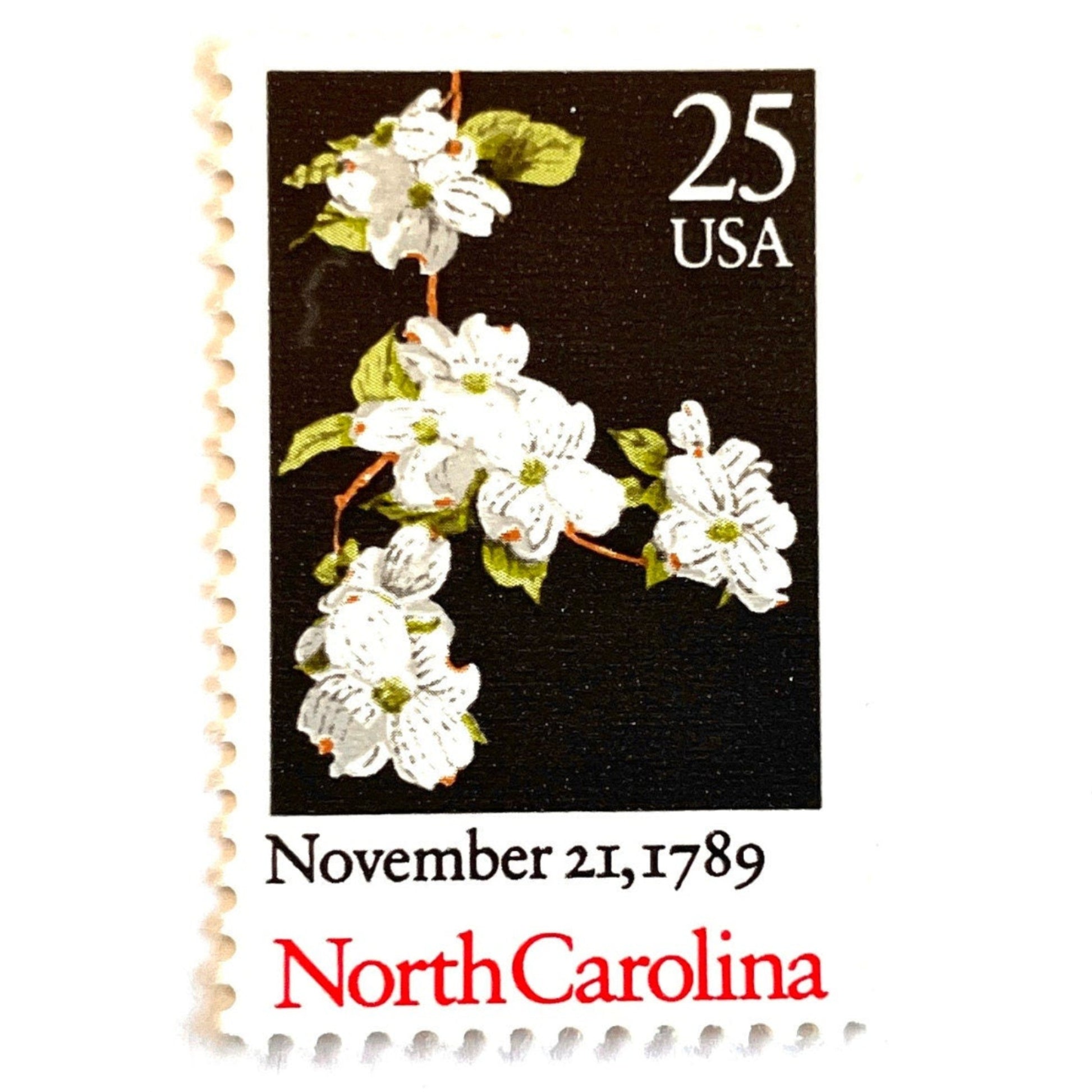 Image of North Carolina Statehood postage stamps from the 1989 Bicentenary Statehood series, featuring white dogwood flowers on a black background on vintage unused 25-cent USPS postage, Scott 2347.