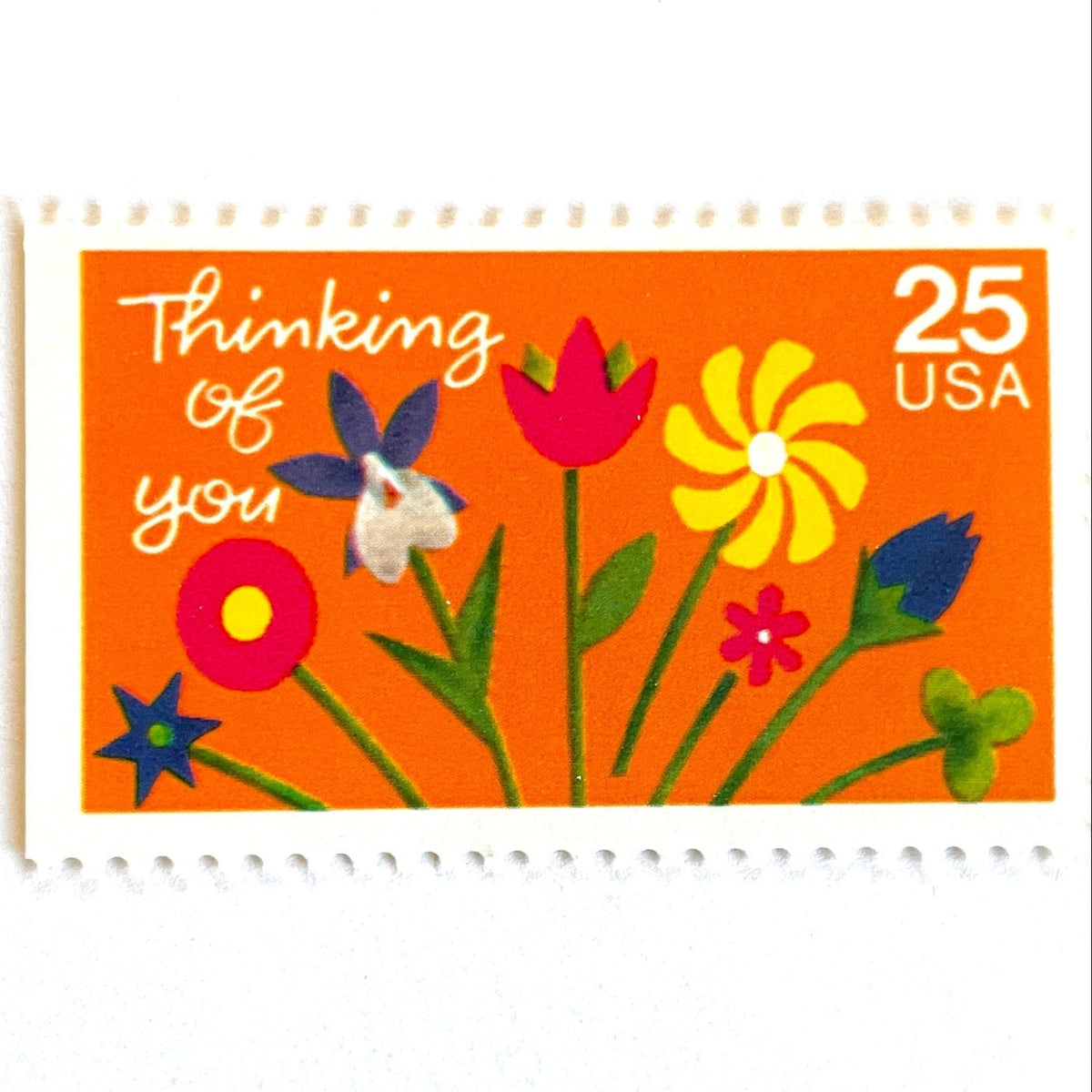 Thinking of You postage stamps from 1988 featuring colorful folk art flowers against a sunny orange background on vintage unused 25-cent USPS postage, Scott 2397.