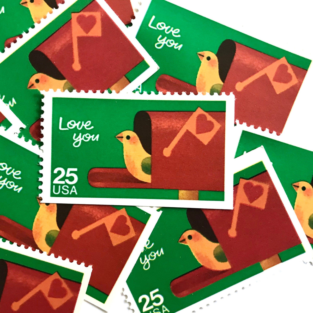 Love You postage stamps from 1988 featuring a bird peeking from an open mailbox against a green background on vintage unused 25-cent USPS postage, Scott 2398.