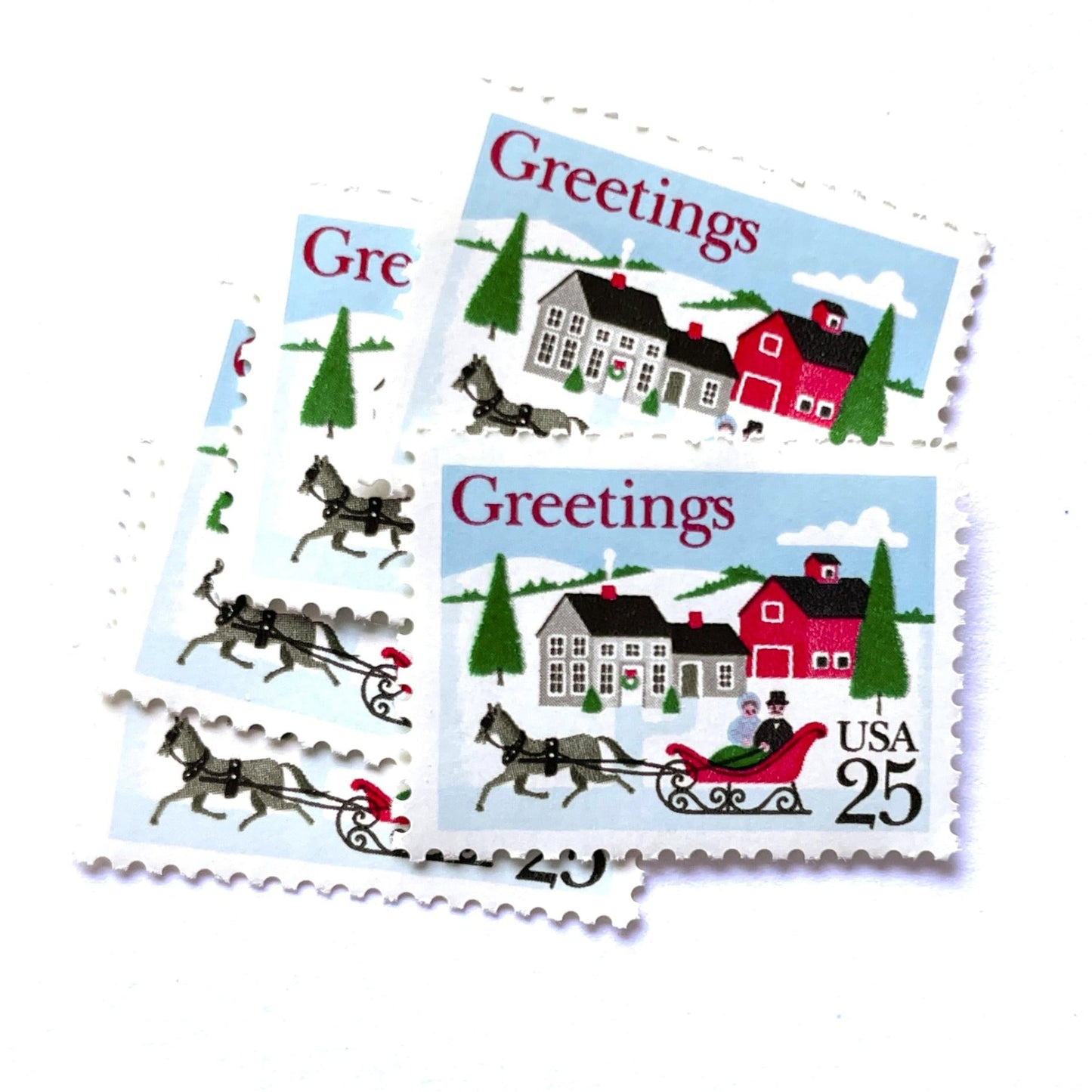 Image of 1988 Contemporary Christmas “Sleigh and Village Scene” 25-cent stamps. Scott #2400. Stamp Themes: Christmas, Holidays, Sleigh Ride, Snow, Greetings, White Christmas, Irving Berlin. Red, Green, White, Multicolored postage stamp.