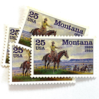 Image of Montana Statehood postage stamps from 1989, featuring C.M. Russell Western art with a cowboy on horseback and riders on vintage unused 25-cent USPS postage, Scott 2401.