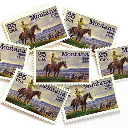 Image of Montana Statehood postage stamps from 1989, featuring C.M. Russell Western art with a cowboy on horseback and riders on vintage unused 25-cent USPS postage, Scott 2401.