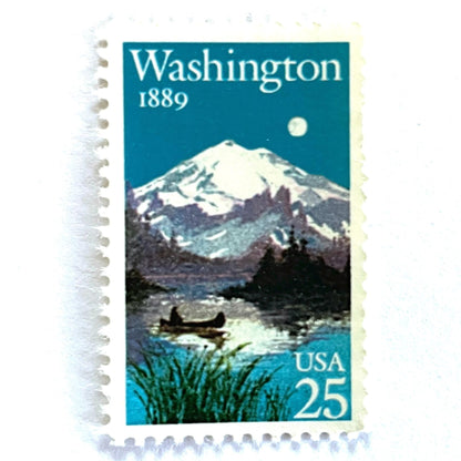 Image of Washington Statehood postage stamps from 1989, featuring Mount Rainier above a quiet lake with a canoe on vintage unused 25-cent USPS postage, Scott 2404.