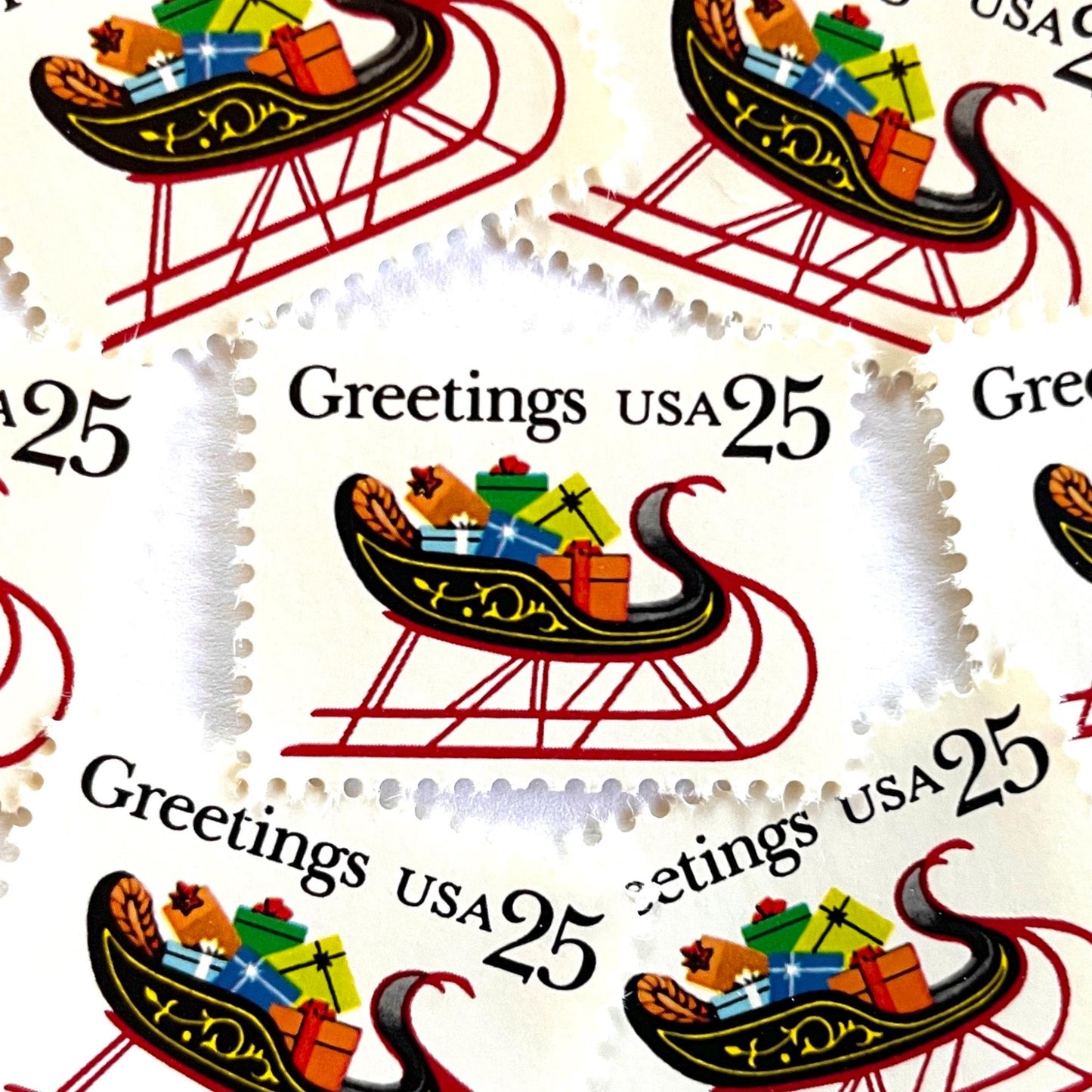 Image of 1989 Contemporary Christmas “Sleigh with Presents” 25-cent stamps. Scott #2428. Stamp Themes: Christmas, Holidays, Sleigh, Santa, Presents, Gifts, Greetings. Multicolored postage stamp.