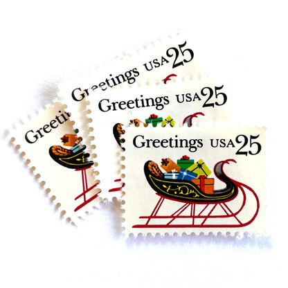 Image of 1989 Contemporary Christmas “Sleigh with Presents” 25-cent stamps. Scott #2428. Stamp Themes: Christmas, Holidays, Sleigh, Santa, Presents, Gifts, Greetings. Multicolored postage stamp.
