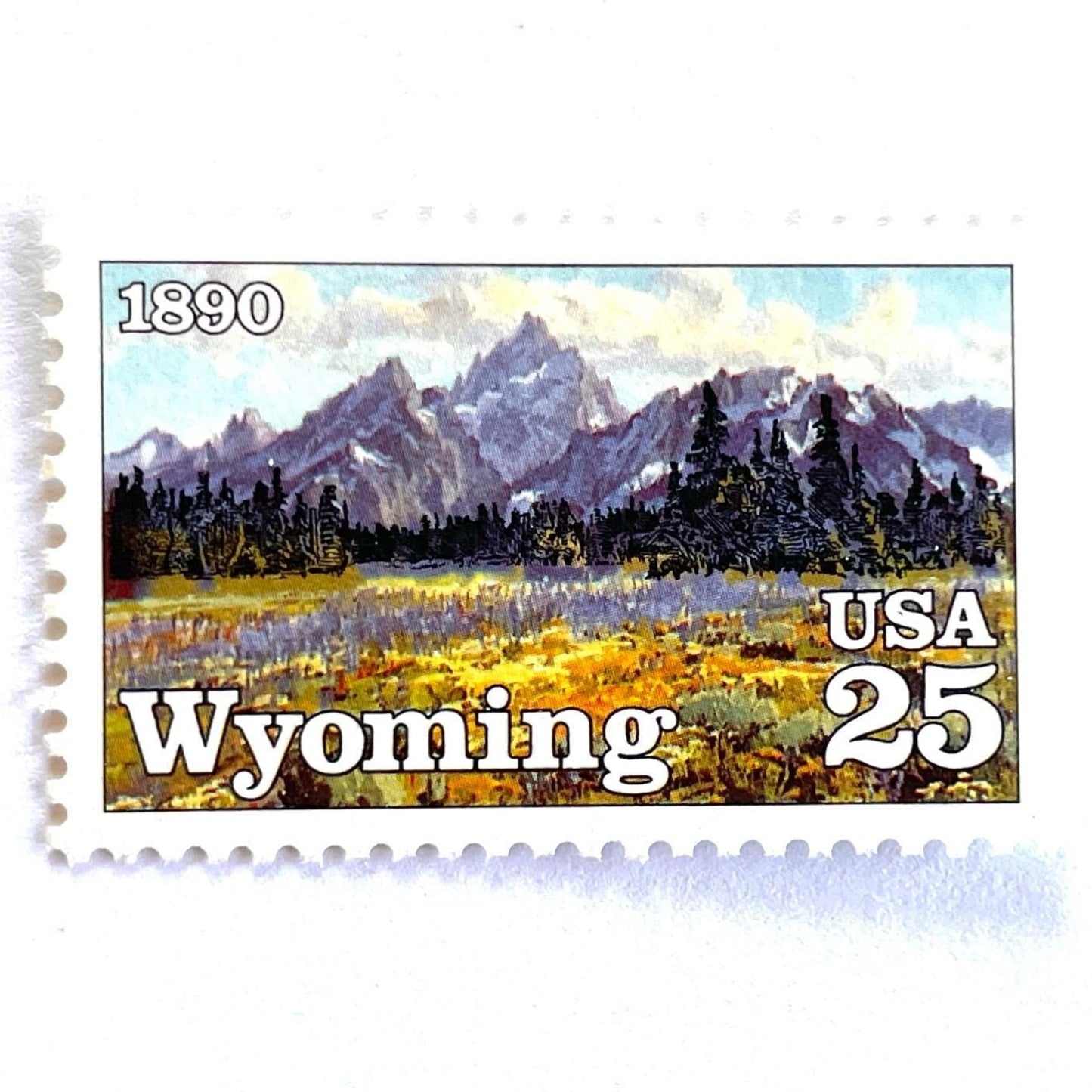 Image of Wyoming Statehood Centennial postage stamps from 1990, featuring the Grand Teton Mountains and wildflower meadow on vintage unused 25-cent USPS postage, Scott 2444.