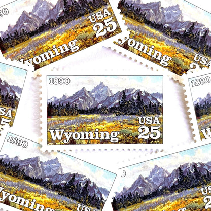 Image of Wyoming Statehood Centennial postage stamps from 1990, featuring the Grand Teton Mountains and wildflower meadow on vintage unused 25-cent USPS postage, Scott 2444.