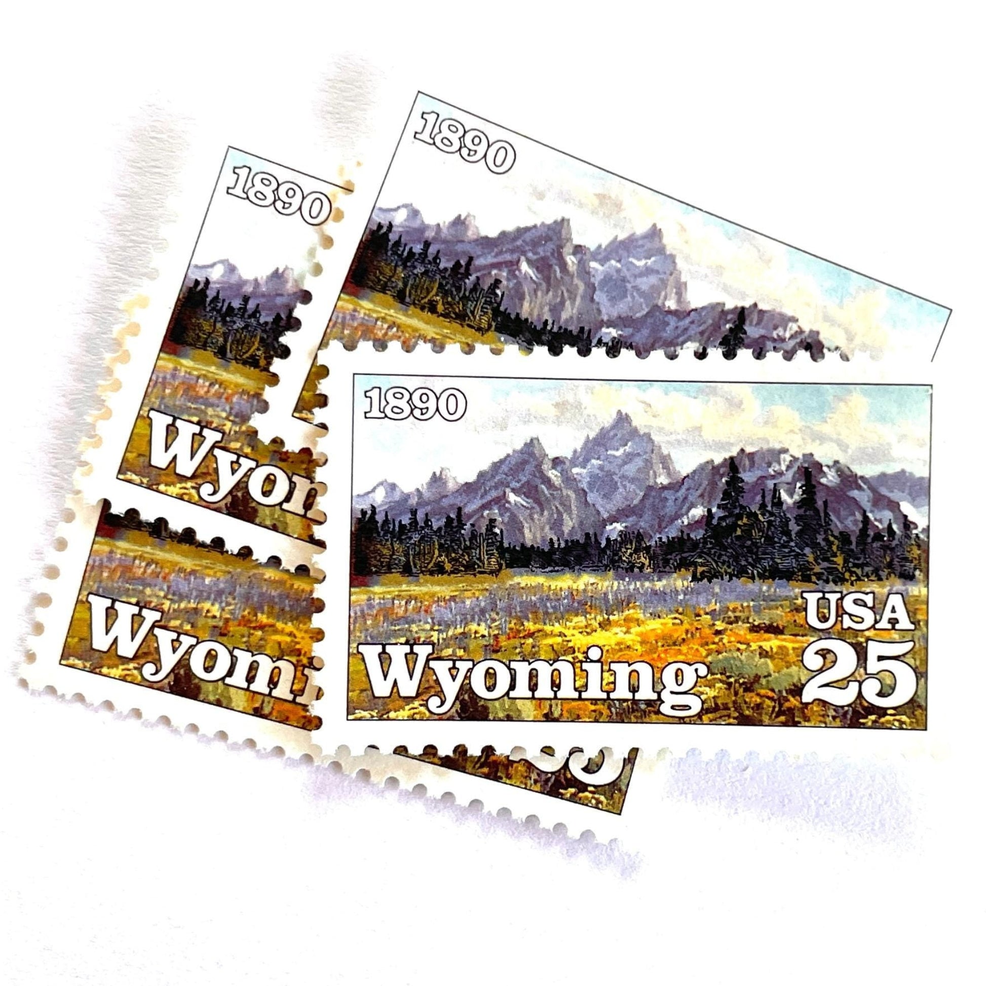 Image of Wyoming Statehood Centennial postage stamps from 1990, featuring the Grand Teton Mountains and wildflower meadow on vintage unused 25-cent USPS postage, Scott 2444.