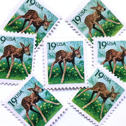 Image of four 19 cent Flora & Fauna Series 1991 Fawn stamps. Scott #2479. Stamp themes: Young Deer, Doe, Calf, Baby, Youth, Spring, Bambi, Birth. Green and blue postage stamp.