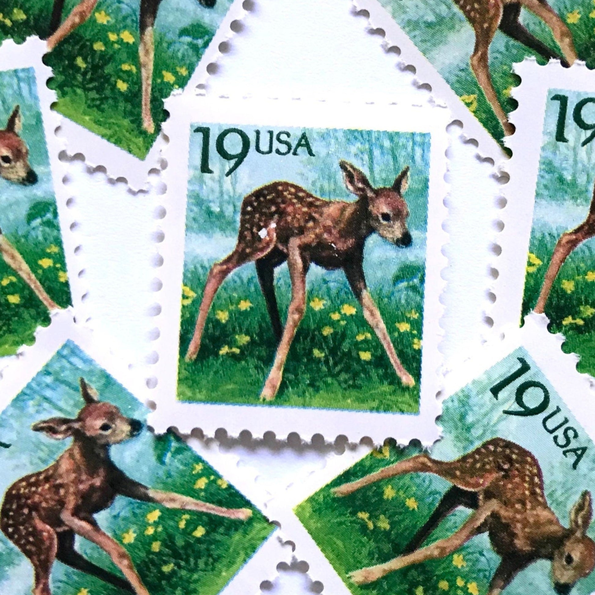 Image of four 19 cent Flora & Fauna Series 1991 Fawn stamps. Scott #2479. Stamp themes: Young Deer, Doe, Calf, Baby, Youth, Spring, Bambi, Birth. Green and blue postage stamp.