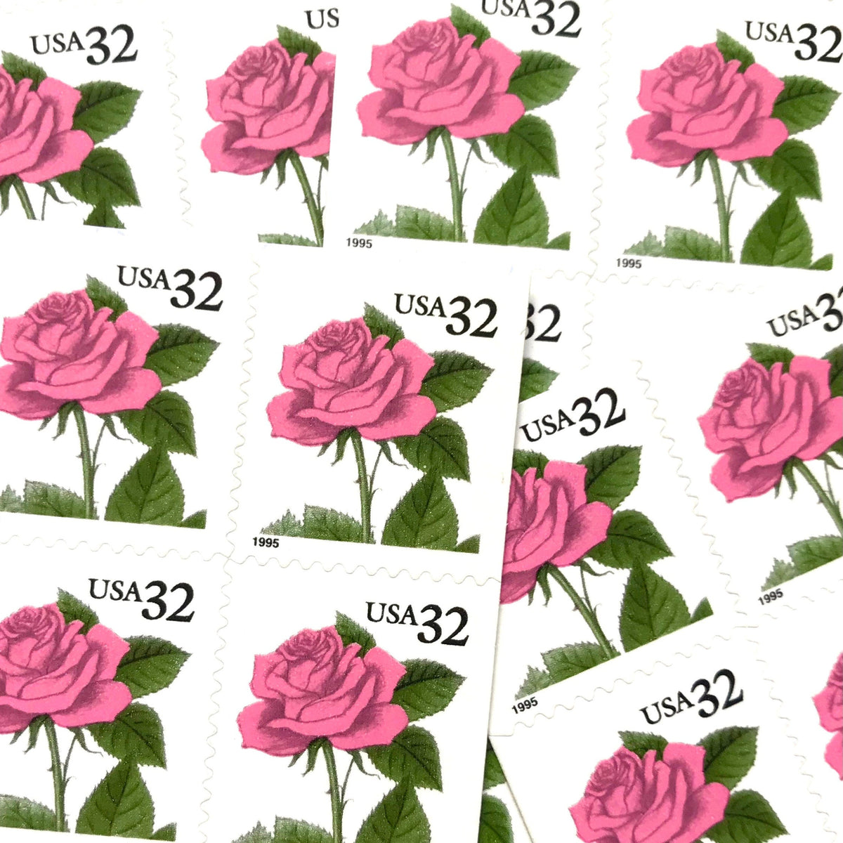 Vintage Pink Rose postage stamps from the 1995 Flora & Fauna series featuring a soft pink rose with green foliage on unused 32-cent USPS postage, Scott 2492.