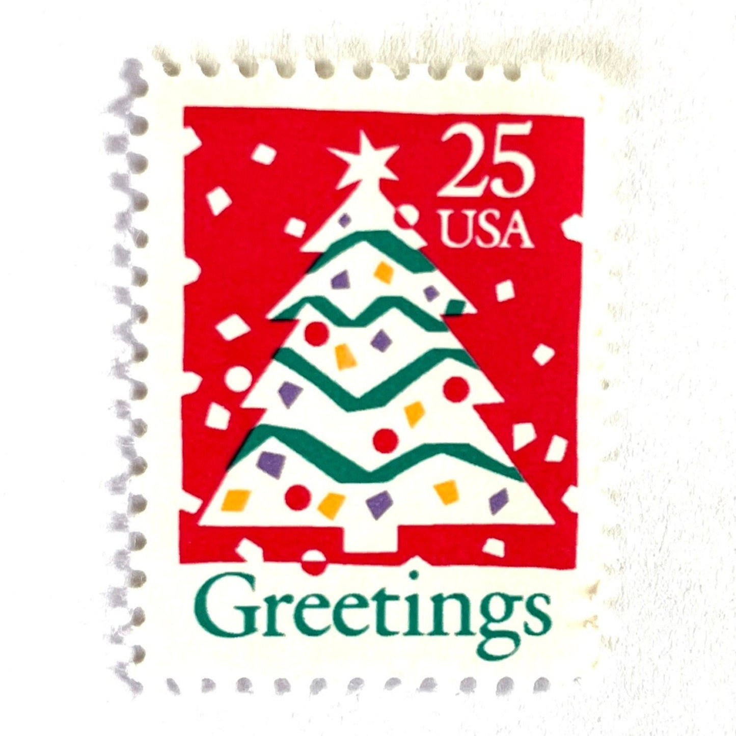 Image of 1990 Contemporary Christmas “Christmas Tree and Greetings” 25-cent stamps. Scott #2515. Stamp Themes: Christmas Decorations, Snow, Snowing, Greetings. Red, green, white postage stamp.