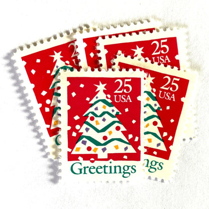 Image of 1990 Contemporary Christmas “Christmas Tree and Greetings” 25-cent stamps. Scott #2515. Stamp Themes: Christmas Decorations, Snow, Snowing, Greetings. Red, green, white postage stamp.