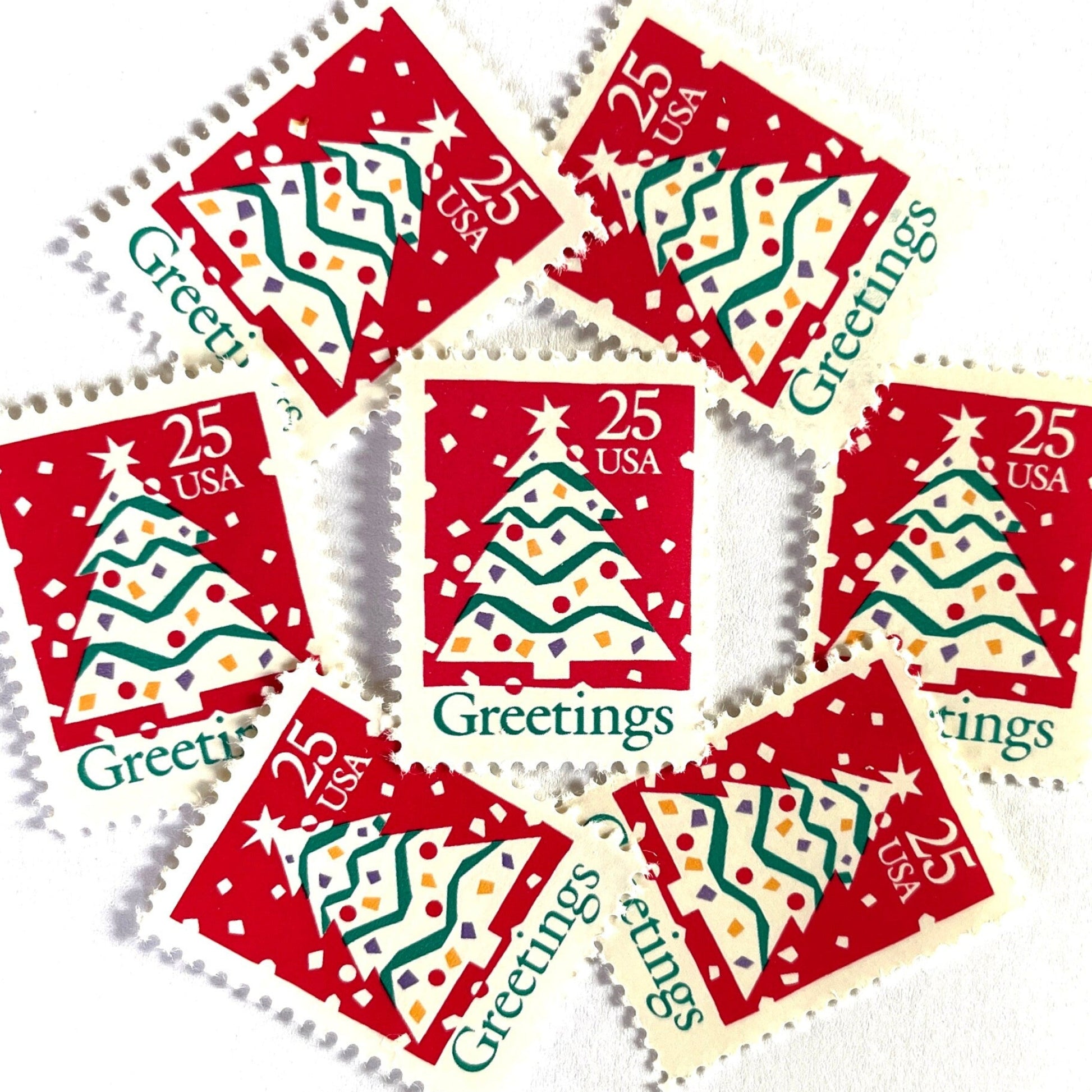 Image of 1990 Contemporary Christmas “Christmas Tree and Greetings” 25-cent stamps. Scott #2515. Stamp Themes: Christmas Decorations, Snow, Snowing, Greetings. Red, green, white postage stamp.