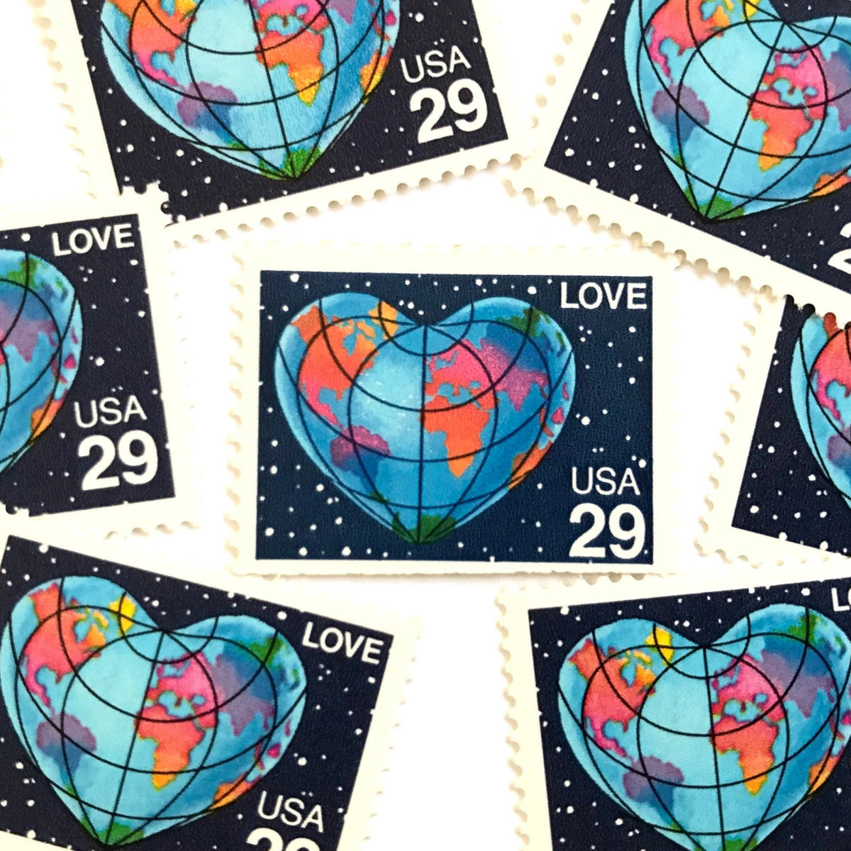 Heart-Shaped Globe postage stamps from 1991 featuring the Earth shaped like a heart with colorful continents on vintage unused 29-cent USPS postage, Scott 2535.