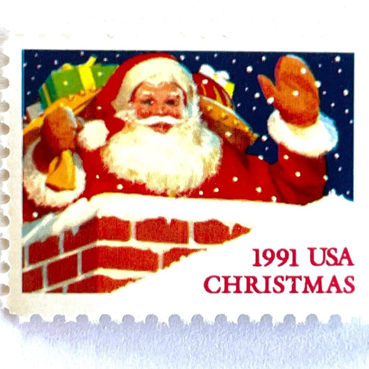 Vintage Santa Claus in Chimney Christmas postage stamp from the 1991 Contemporary Christmas series featuring Santa descending a chimney during his Christmas Eve journey on unused 29-cent USPS postage, Scott 2579.