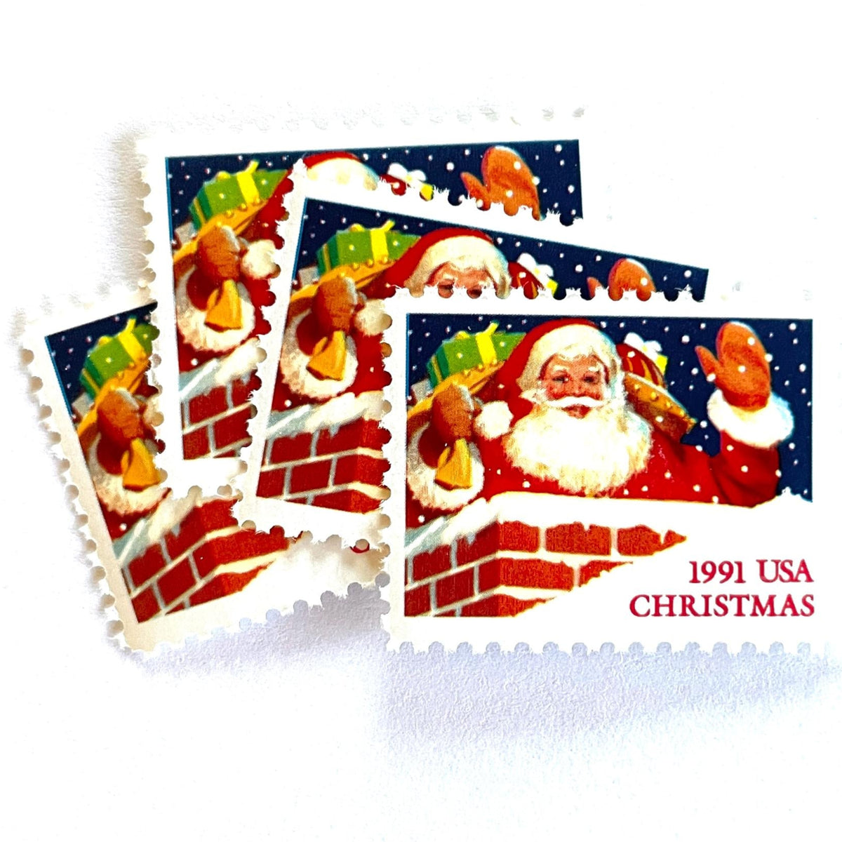 Vintage Santa Claus in Chimney Christmas postage stamps from the 1991 Contemporary Christmas series featuring Santa descending a chimney during his Christmas Eve journey on unused 29-cent USPS postage, Scott 2579.