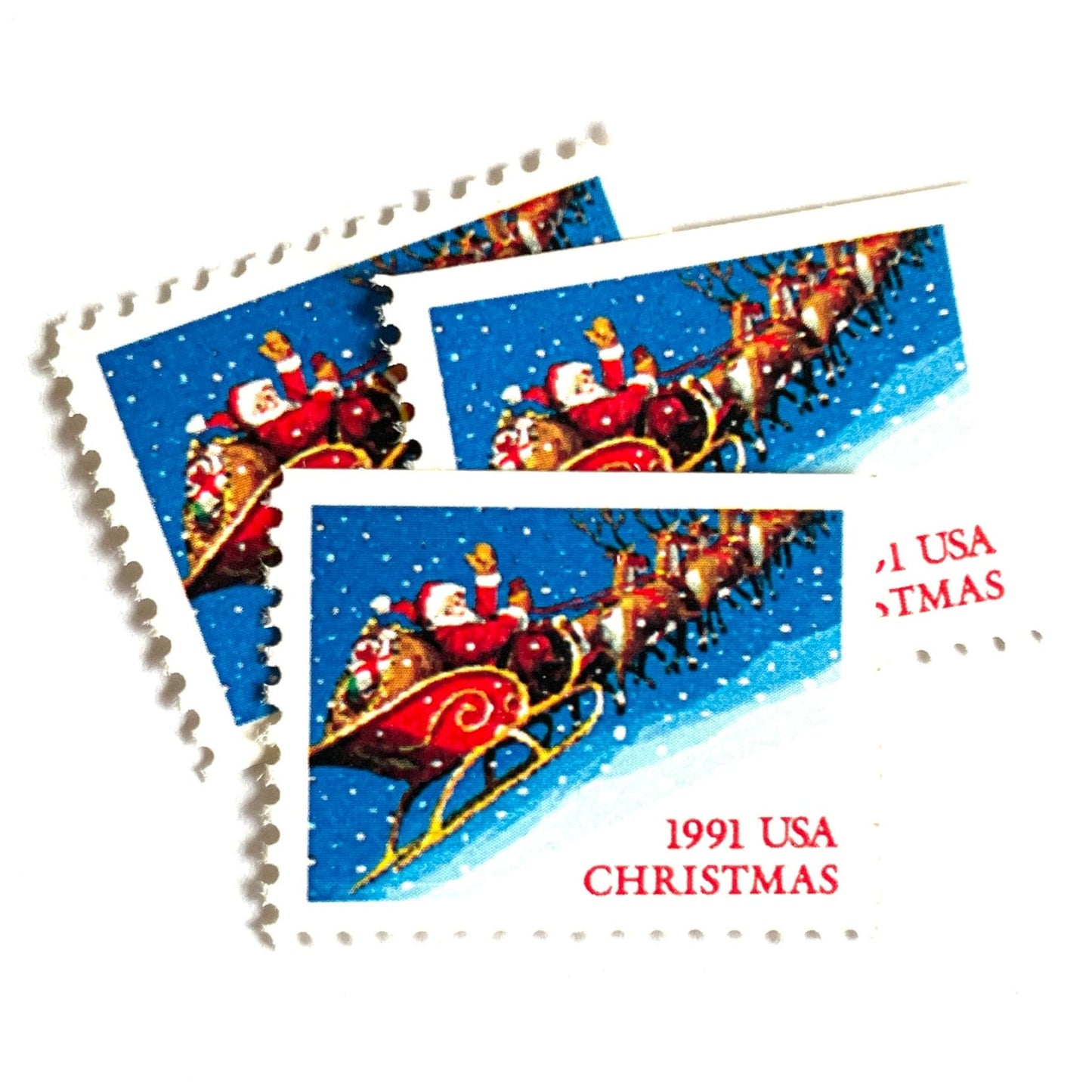 Image of 1991 Contemporary Christmas Series “Santa and Sleigh” 29-cent mail stamps. Scott #2585. Stamp Themes: Santa Claus, Santa’s Sleigh, Christmas, Holiday, Holidays, Winter, Night Sky, Snowing. Blue postage stamp.