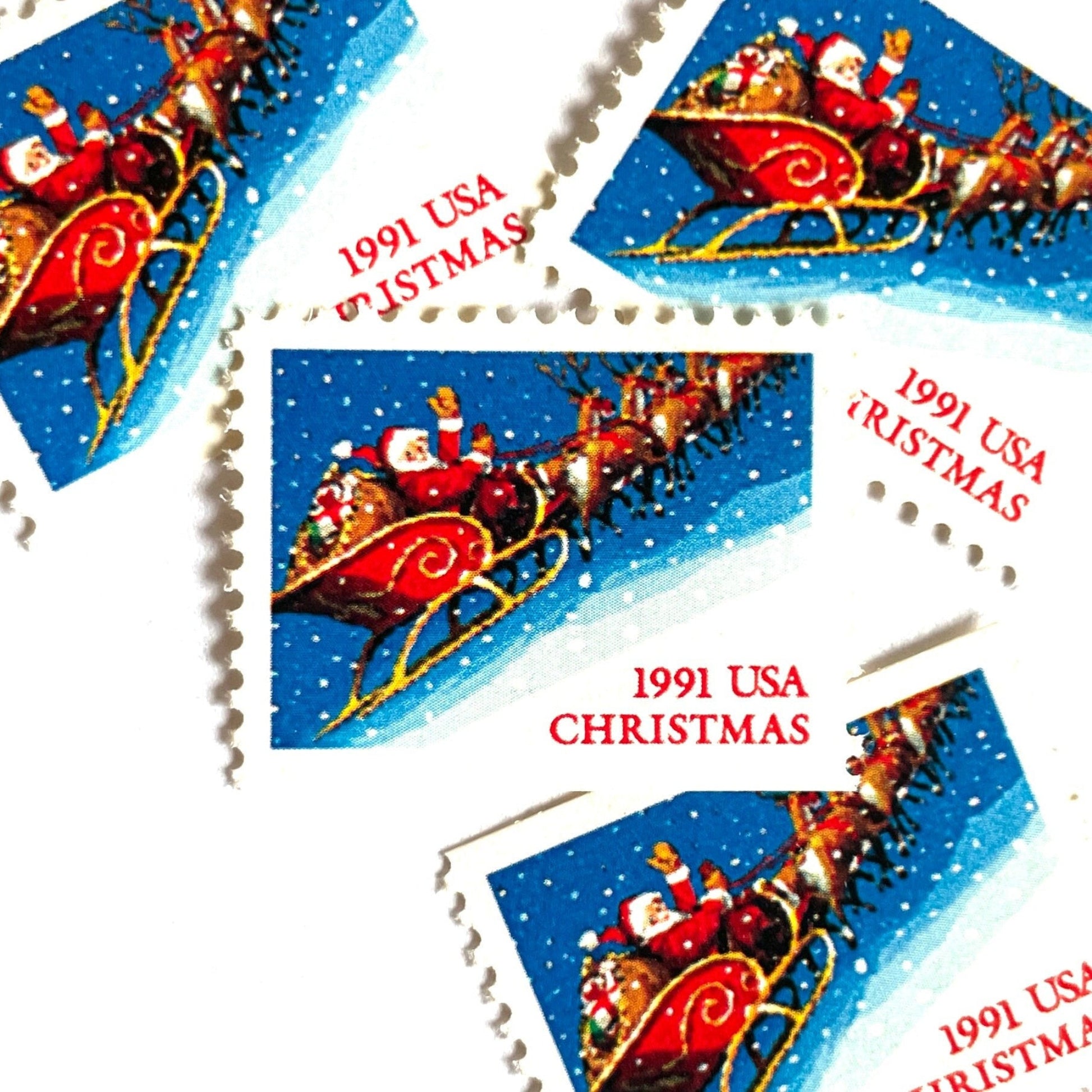 Image of 1991 Contemporary Christmas Series “Santa and Sleigh” 29-cent mail stamps. Scott #2585. Stamp Themes: Santa Claus, Santa’s Sleigh, Christmas, Holiday, Holidays, Winter, Night Sky, Snowing. Blue postage stamp.
