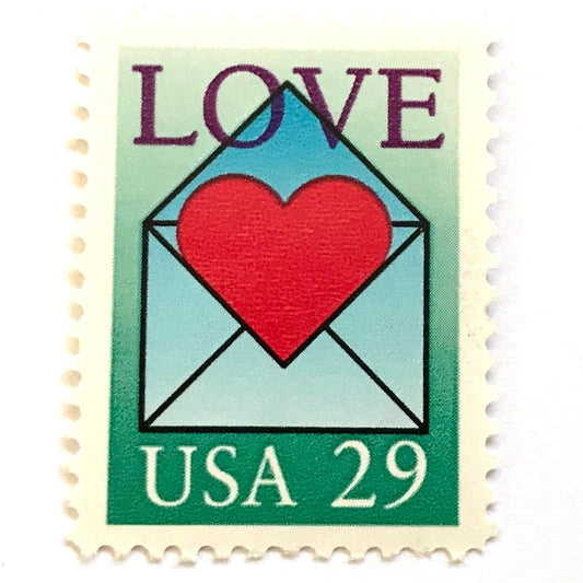 Love Envelope and Heart postage stamp from 1992 featuring a red heart emerging from an open blue envelope on vintage unused 29-cent USPS postage, Scott 2618.