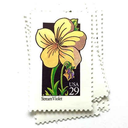 Image of 29-cent USPS postage stamps featuring a yellow Stream Violet flower from the 1992 American Wildflower Series (Scott #2655)