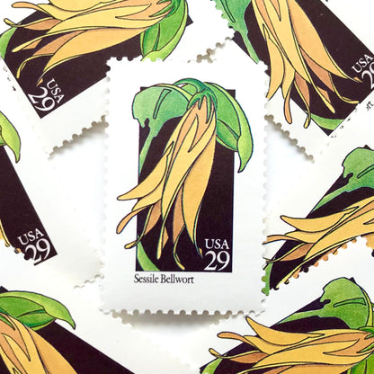 Image of 1992 American Wildflower Series “Sessile Bellwort ” vintage USPS mail stamps. Scott #2662. Stamp Themes: Plants, Flowers, Wildflowers, Flora. Yellow, Green, Black, Multicolored gummed postage stamp. Perfect postage stamp to use for save the date announcements, wedding invitation postage, bridal shower invitations, birth announcements, valentine’s day, thank you cards, and snail mail.