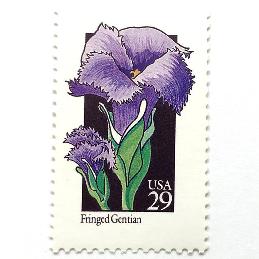 Image of 1992 American Wildflower Series “Fringed Gentian” vintage USPS mail stamps. Scott #2672. Stamp Themes: Plants, Flowers, Wildflowers, Flora. Purple, Green, Black, Multicolored gummed postage stamp. Perfect postage stamp to use for save the date announcements, wedding invitation postage, bridal shower invitations, birth announcements, valentine’s day, thank you cards, and snail mail.