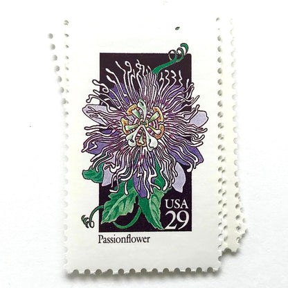Image of 1992 American Wildflower Series “Passionflower” vintage USPS mail stamps. Scott #2674. Stamp Themes: Plants, Flowers, Wildflowers, Flora. Purple, Green, Black, Multicolored gummed postage stamp. Perfect postage stamp to use for save the date announcements, wedding invitation postage, bridal shower invitations, birth announcements, valentine’s day, thank you cards, and snail mail.