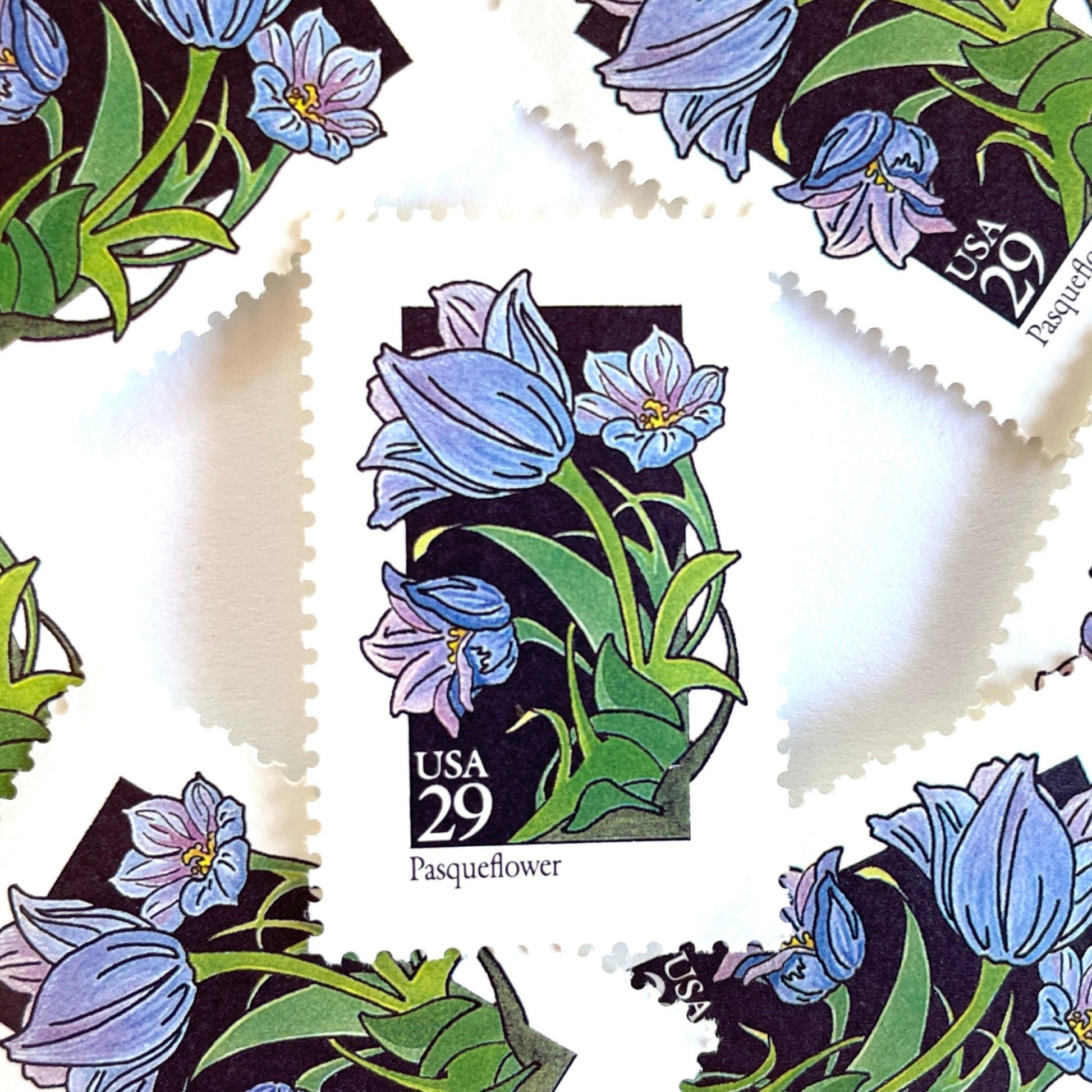 Image of 1992 American Wildflower Series “Pasqueflower” vintage USPS mail stamps. Scott #2676. Stamp Themes: Plants, Flowers, Wildflowers, Flora. Purple, Blue, Green, Multicolored gummed postage stamp. Perfect postage stamp to use for save the date announcements, wedding invitation postage, bridal shower invitations, birth announcements, valentine’s day, thank you cards, and snail mail.