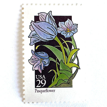 Image of 1992 American Wildflower Series “Pasqueflower” vintage USPS mail stamps. Scott #2676. Stamp Themes: Plants, Flowers, Wildflowers, Flora. Purple, Blue, Green, Multicolored gummed postage stamp. Perfect postage stamp to use for save the date announcements, wedding invitation postage, bridal shower invitations, birth announcements, valentine’s day, thank you cards, and snail mail.