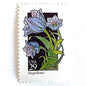 Image of 1992 American Wildflower Series “Pasqueflower” vintage USPS mail stamps. Scott #2676. Stamp Themes: Plants, Flowers, Wildflowers, Flora. Purple, Blue, Green, Multicolored gummed postage stamp. Perfect postage stamp to use for save the date announcements, wedding invitation postage, bridal shower invitations, birth announcements, valentine’s day, thank you cards, and snail mail.