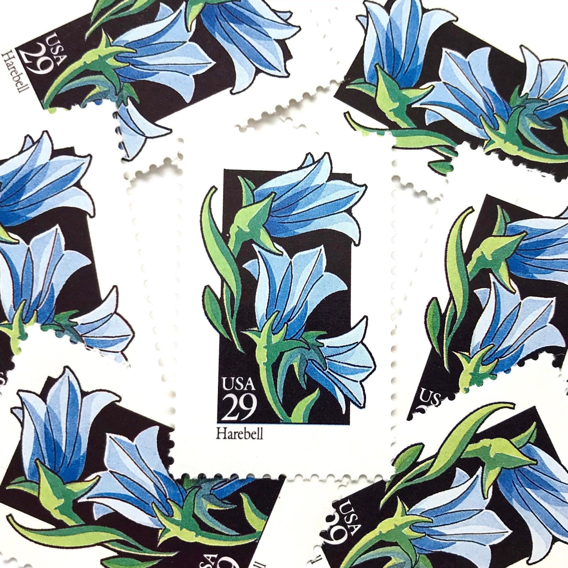 Image of 1992 American Wildflower Series “Harebell” vintage USPS mail stamps. Scott #2689. Stamp Themes: Plants, Flowers, Wildflowers, Flora. Blue, Green, Black, Multicolored gummed postage stamp. Perfect postage stamp to use for save the date announcements, wedding invitation postage, bridal shower invitations, birth announcements, valentine’s day, thank you cards, and snail mail.