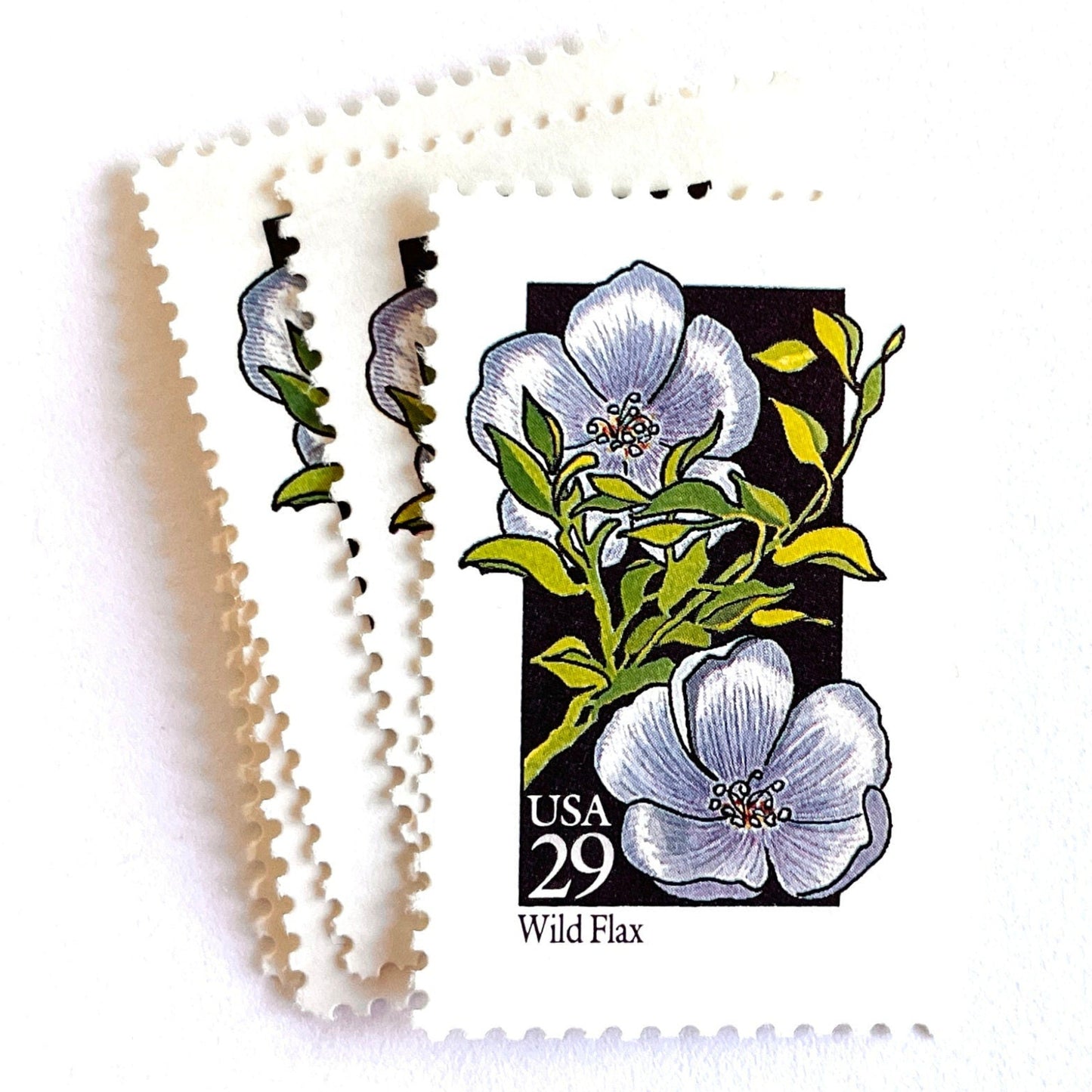 Image of 1992 American Wildflower Series “Wild Flax” vintage USPS mail stamps. Scott #2696. Stamp Themes: Plants, Flowers, Wildflowers, Flora. Blue, Green, Black, Multicolored gummed postage stamp. Perfect postage stamp to use for save the date announcements, wedding invitation postage, bridal shower invitations, birth announcements, valentine’s day, thank you cards, and snail mail.