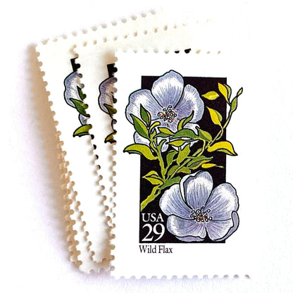Image of 1992 American Wildflower Series “Wild Flax” vintage USPS mail stamps. Scott #2696. Stamp Themes: Plants, Flowers, Wildflowers, Flora. Blue, Green, Black, Multicolored gummed postage stamp. Perfect postage stamp to use for save the date announcements, wedding invitation postage, bridal shower invitations, birth announcements, valentine’s day, thank you cards, and snail mail.