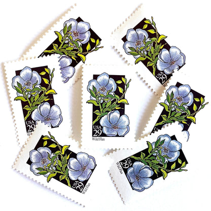 Image of 1992 American Wildflower Series “Wild Flax” vintage USPS mail stamps. Scott #2696. Stamp Themes: Plants, Flowers, Wildflowers, Flora. Blue, Green, Black, Multicolored gummed postage stamp. Perfect postage stamp to use for save the date announcements, wedding invitation postage, bridal shower invitations, birth announcements, valentine’s day, thank you cards, and snail mail.