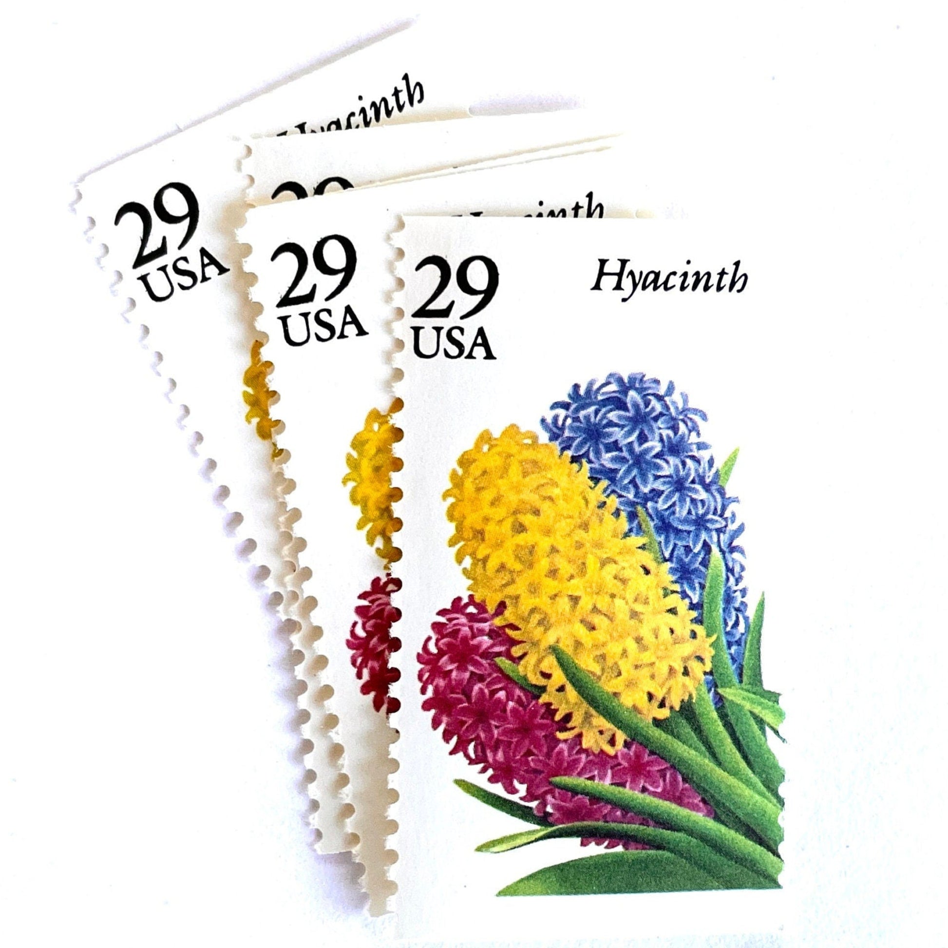 Image of Hyacinth postage stamps from the 1993 Spring Garden Flowers series, featuring purple hyacinth blooms with green foliage on vintage unused 29-cent USPS postage, Scott 2760.
