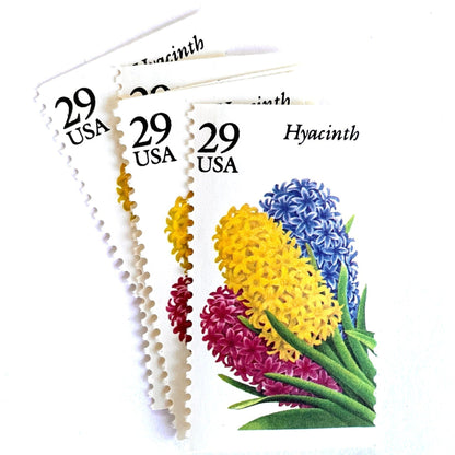 Image of Hyacinth postage stamps from the 1993 Spring Garden Flowers series, featuring purple hyacinth blooms with green foliage on vintage unused 29-cent USPS postage, Scott 2760.