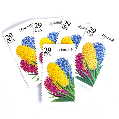 Image of Hyacinth postage stamps from the 1993 Spring Garden Flowers series, featuring purple hyacinth blooms with green foliage on vintage unused 29-cent USPS postage, Scott 2760.