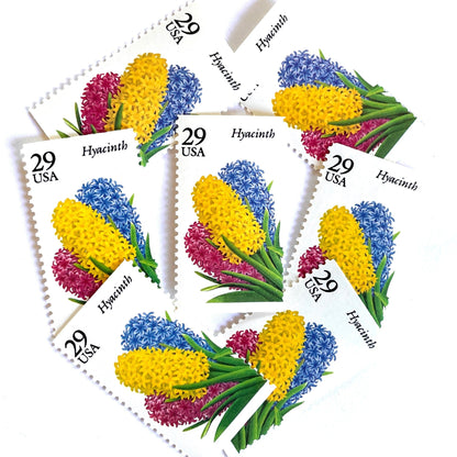 Image of Hyacinth postage stamps from the 1993 Spring Garden Flowers series, featuring purple hyacinth blooms with green foliage on vintage unused 29-cent USPS postage, Scott 2760.