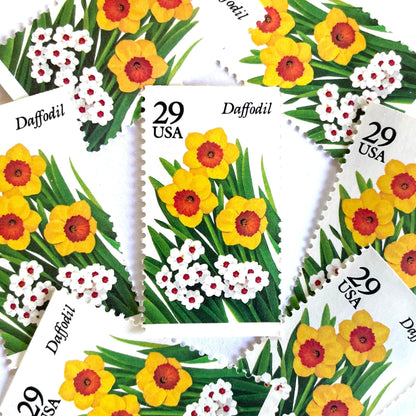 Image of vintage unused USPS Daffodil postage stamps from the 1993 Spring Garden Flowers series, featuring yellow and white daffodil blooms with green foliage, 29-cent face value, Scott 2761.