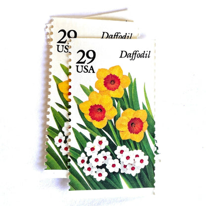 Image of vintage unused USPS Daffodil postage stamps from the 1993 Spring Garden Flowers series, featuring yellow and white daffodil blooms with green foliage, 29-cent face value, Scott 2761.