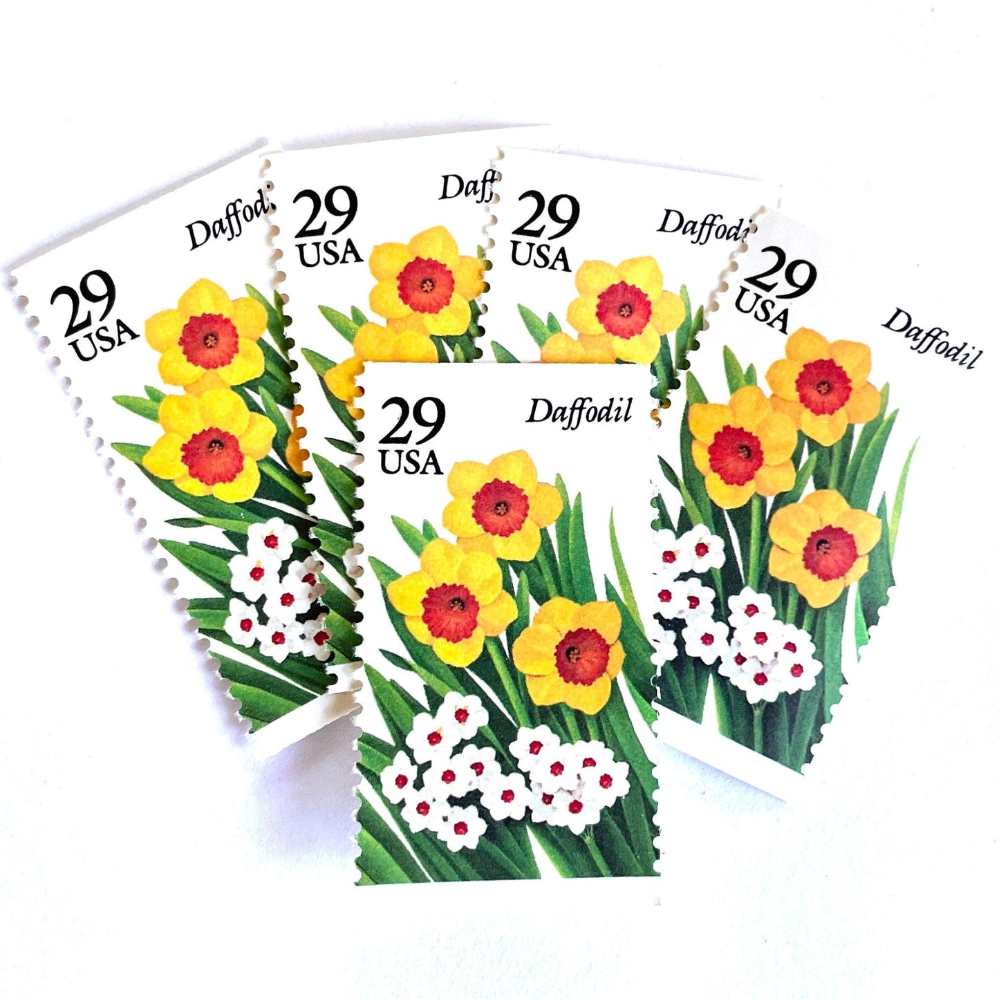 Image of vintage unused USPS Daffodil postage stamps from the 1993 Spring Garden Flowers series, featuring yellow and white daffodil blooms with green foliage, 29-cent face value, Scott 2761.