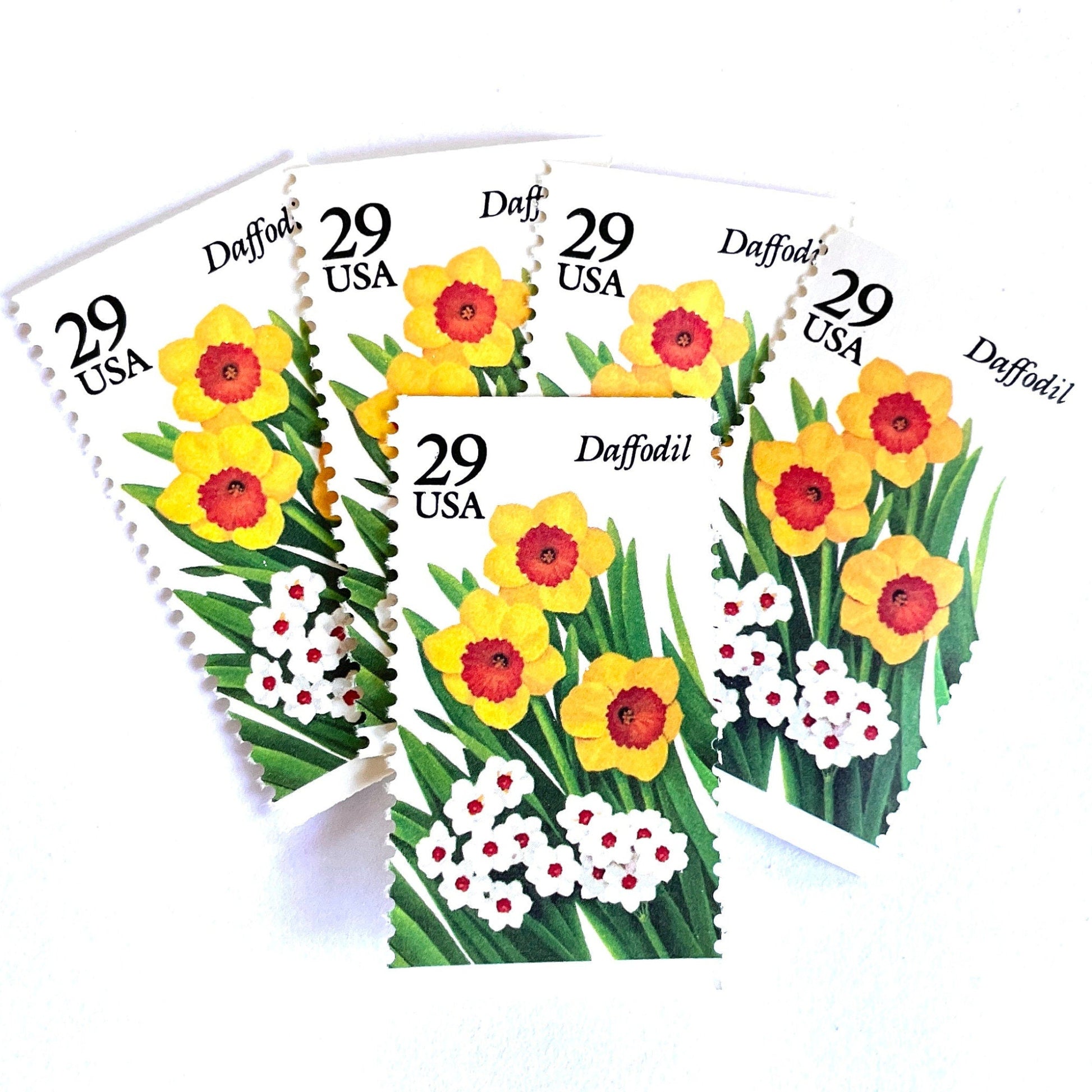 Image of vintage unused USPS Daffodil postage stamps from the 1993 Spring Garden Flowers series, featuring yellow and white daffodil blooms with green foliage, 29-cent face value, Scott 2761.