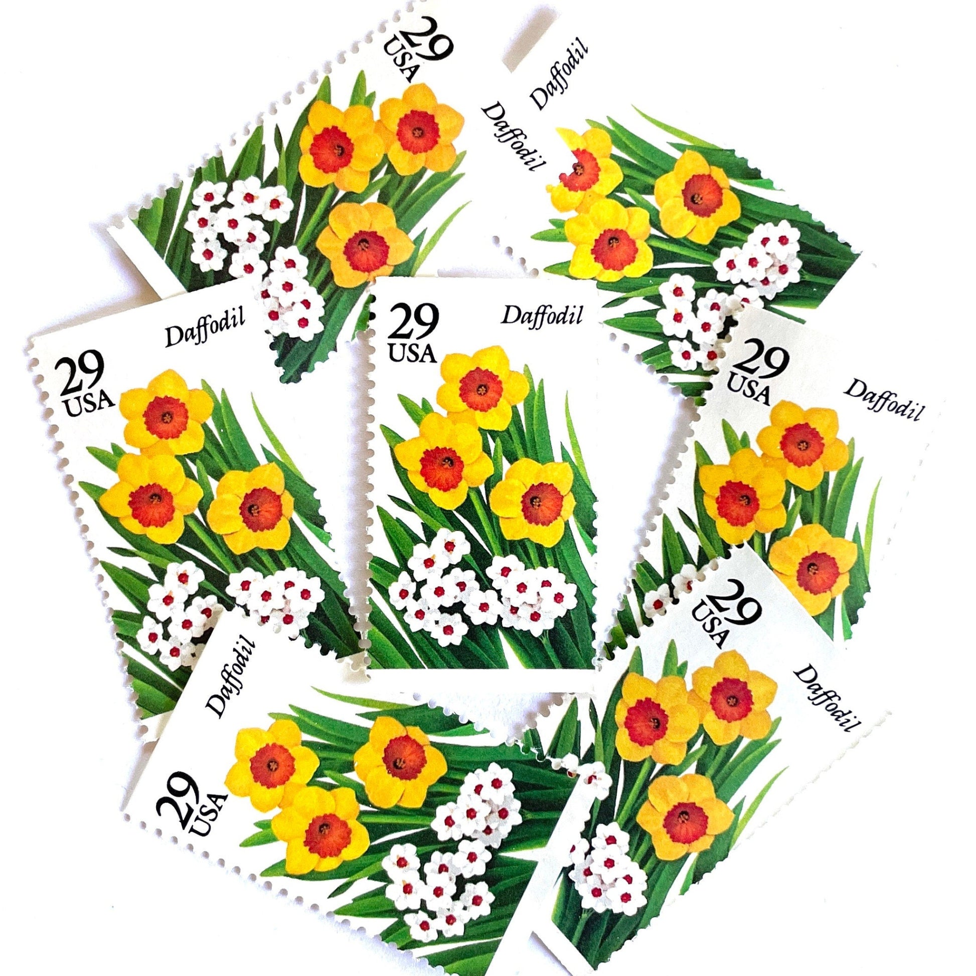 Image of vintage unused USPS Daffodil postage stamps from the 1993 Spring Garden Flowers series, featuring yellow and white daffodil blooms with green foliage, 29-cent face value, Scott 2761.
