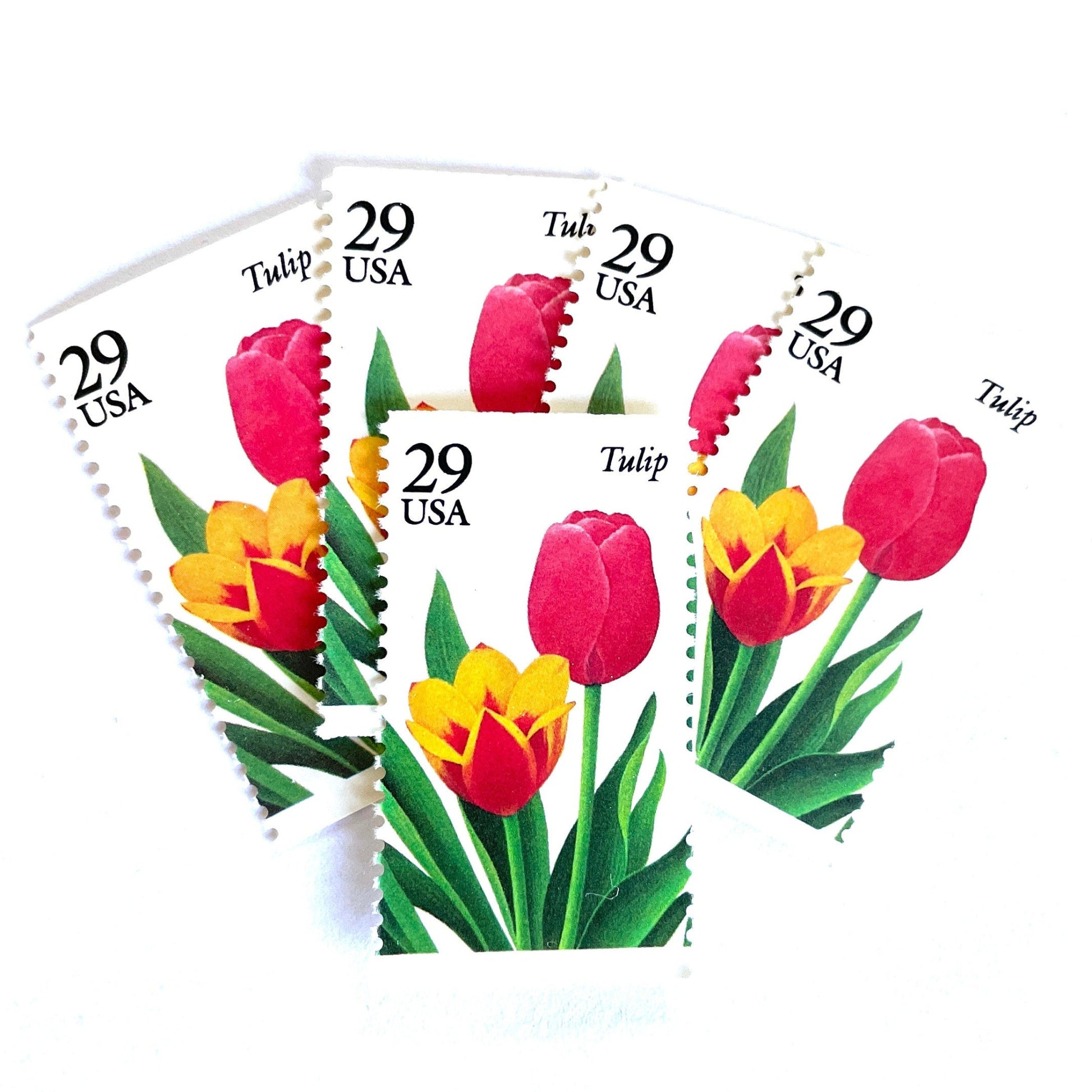 Image of Tulip postage stamps from the 1993 Spring Garden Flowers series, featuring red and yellow tulip blooms with green foliage on vintage unused 29-cent USPS postage, Scott 2762.